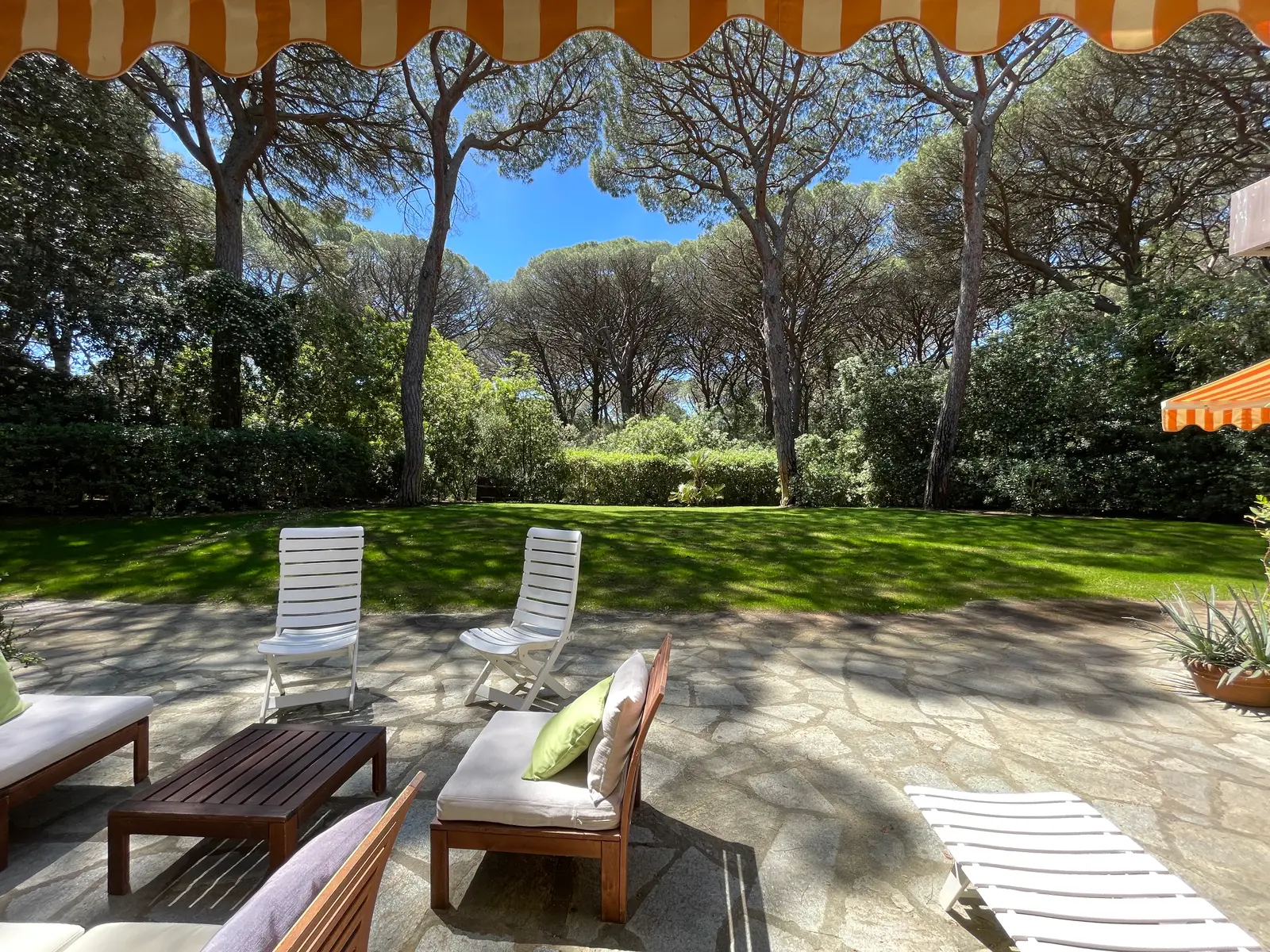Patio with armchairs and grill
